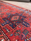 Tribal medallion wool runner rug close-up capturing the rustic northwest Persian weave and intricate details.