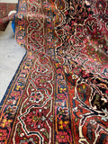 Handmade antique Persian Bakhtiari rug with tribal geometric pattern, collectible wool area rug.