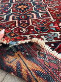 Antique Persian Heriz rug. Hand knotted wool gallery carpet with bold tribal artwork, stepped medallions, vegetable-dyed wool, and heirloom-quality craftsmanship.
