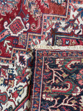 Underside view of Antique Persian Heriz area rug. Large hand knotted wool carpet with vivid vegetable dyes, geometric medallion, uncommon border, and heirloom-quality craftsmanship.