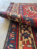 Persian Heriz rug with sturdy wool construction and rich vegetable dyed colors.
