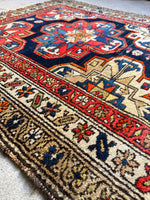 Rug border with simple botanical motifs.