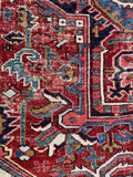 9x12 antique Persian rug for living room, authentic Heriz rug with powerful geometric artwork and historic character.