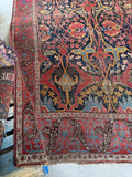 Corner of the rug showing main field and border pattern.
