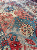 Late 19th-century Caucasian rug highlighting rich vegetable dyes and traditional hand-woven tribal details.