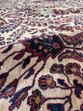 Vintage ivory Persian Sarouk rug angled perspective shot emphasizing the luster of the high-grade wool.