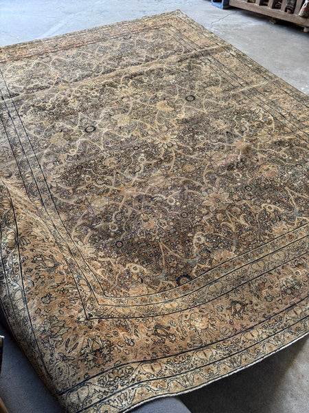 Neutral Persian Lavar rug with intricate scrolling and floral work.
