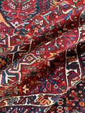 Vintage Persian wool gallery rug. Antique Heriz carpet with geometric tribal artwork, naturally aged vegetable dyes, and a sturdy hand-knotted construction.