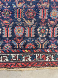 Persian bird motif tribal rug with handwoven chickens and long-tailed peacocks.