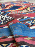 Red and blue antique rug in 100 percent pure wool flatweave construction without borders.