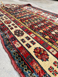 Vintage wool Caucasian runner rug with a beautifully worn handmade surface.