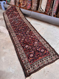 Vintage 1940s Persian narrow runner full view capturing the authentic mid-century antique character and complete design.