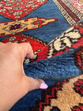 Durable vintage Persian runner with low pile for a high-traffic hallway.