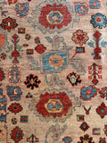 Close-up view artisan handwoven Heriz rug with even wool pile and rich wear.