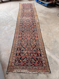 Antique Malayer Persian runner measuring 3’4 x 14’5 featuring a timeworn navy blue ground and classic Herati design.