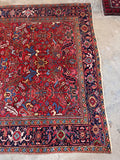 A statement antique area rug in rich colors made with vegetable dyed wool.