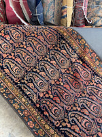 Narrow Persian runner showing vibrant natural dye colors.