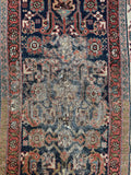 Close up of early 1920s Persian Malayer hallway runner in vegetable dyed wool with some wear.