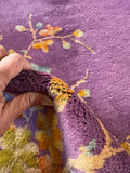 Detail of soft, even wool pile on purple field.