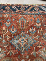 Old world Heriz rug with symmetrical medallion and floral spray