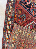 Durable weave of the Persian Heriz runner up close.