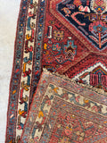 Durable weave of the Persian Heriz runner up close.