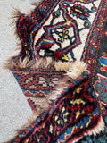 Folded rug showcasing pile and weave.