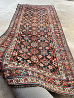 Full overhead view of Veramin rug with navy to space blue ground