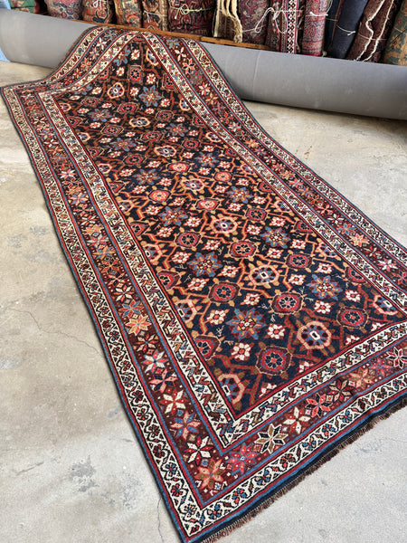 Full image of Veramin rug displaying symmetrical Mina Khani design