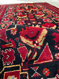 Wool vintage Persian rug 3x6 showing hand knotted construction on wool foundation close up shot
