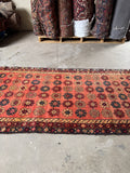 Persian runner showing burgundy, blue, wheat, and toffee flower rows.