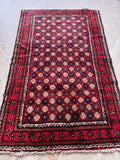 Mid century tribal Persian scatter rug wide view capturing the full 3'1 x 4'10 proportions and authentic hand-bound edges.