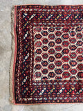 Hand knotted 1920s wool accent rug for entryways, bedside, or kitchen spaces.