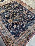 Village Mahal rug with traditional border design on warm wheat ground.