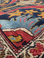 Handwoven wool texture from antique Bidjar rug.