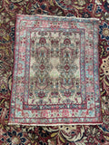 Vintage oriental Persian Lavar Kerman rug angle view with sky blue border
