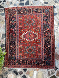 Antique Persian Heriz Karaja tribal rug pile fold detail, rust red and navy, c.1920s
