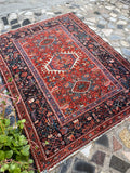Full overhead flatlay of antique 1920s Persian tribal rug, 3'8 × 4'8
