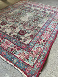 Antique Persian Lavar Kerman corner wear detail showing age and construction
