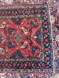Close-up of a colorful patterned rug with intricate designs.