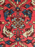 Vintage Persian wool rug herati design closeup, navy ivory blue on coral
