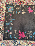 Vintage Art Deco Chinese rug blue chrysanthemum closeup on espresso brown
