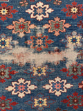 Close-up detail of the central wear mark on a 1920s antique Caucasian prayer rug.