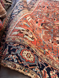 Low pile durable high traffic rug close-up texture shot showing low-pile wool surface, tight knotting, and authentic aged patina.