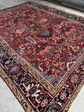Heavy wool pile and vibrant dye work on an antique Persian rug.