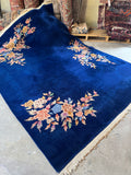 Vintage Art Deco Chinese rug with minimal floral decoration and sheen.