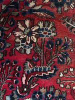 Persian rug texture highlighting light pink and ivory accents.