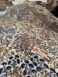 Vintage Persian rug with Birds of Paradise and cascading botanical art.