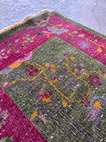 Vintage low pile Art Deco area rug with clean lines, floral motifs, and rich vegetable dyed wool.