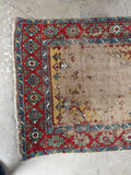 Antique Caucasian runner, collectible hand knotted vintage wool rug with authentic age-earned wear, tribal artistry, vegetable dyed wool, and timeless farmhouse appeal.